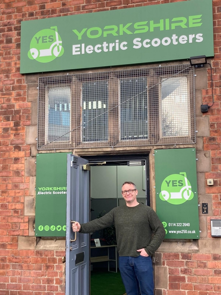 Gordon Riley outside Yorkshire Electric Scooters